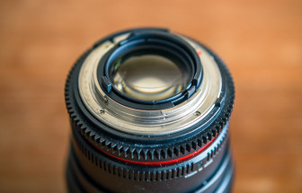 Nikon lenses use a mechanical lever to adjust aperture